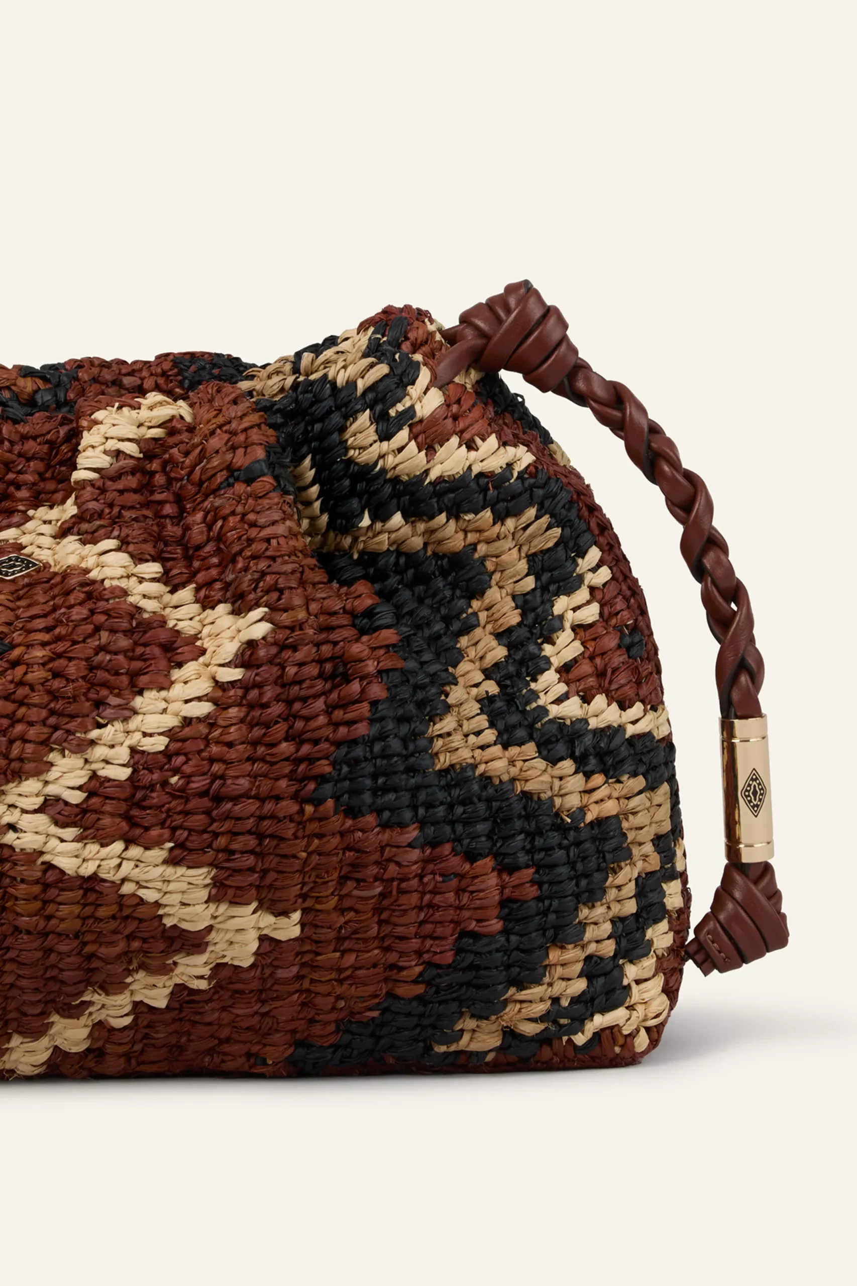 JUNE tribal-inspired raffia clutch